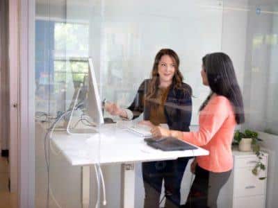 Two women discussing work