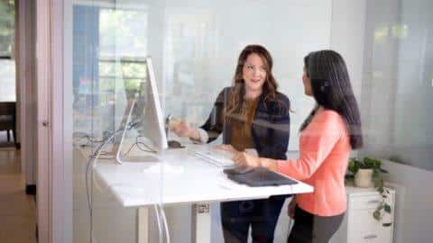 Two women discussing work