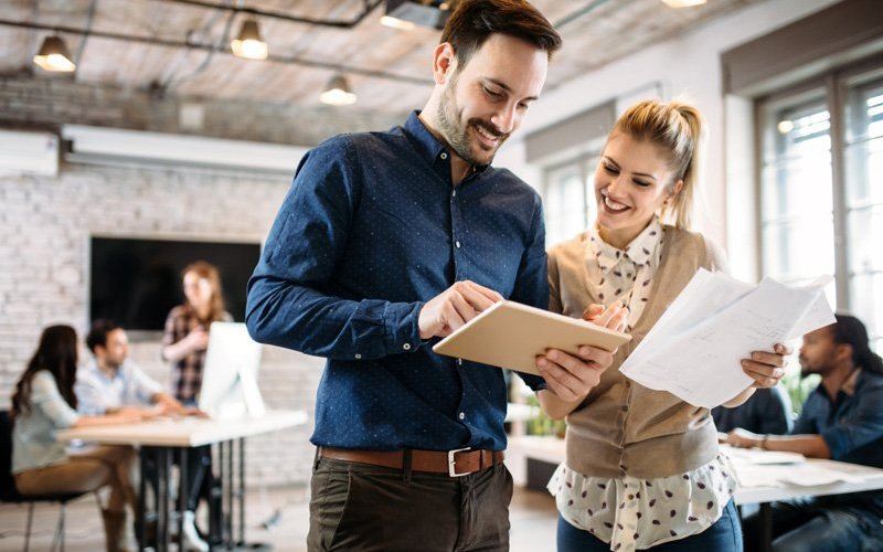 Man and woman talking at work