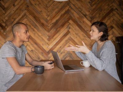 Sitting talking to a colleague