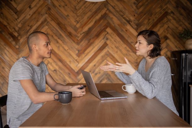 Sitting talking to a colleague