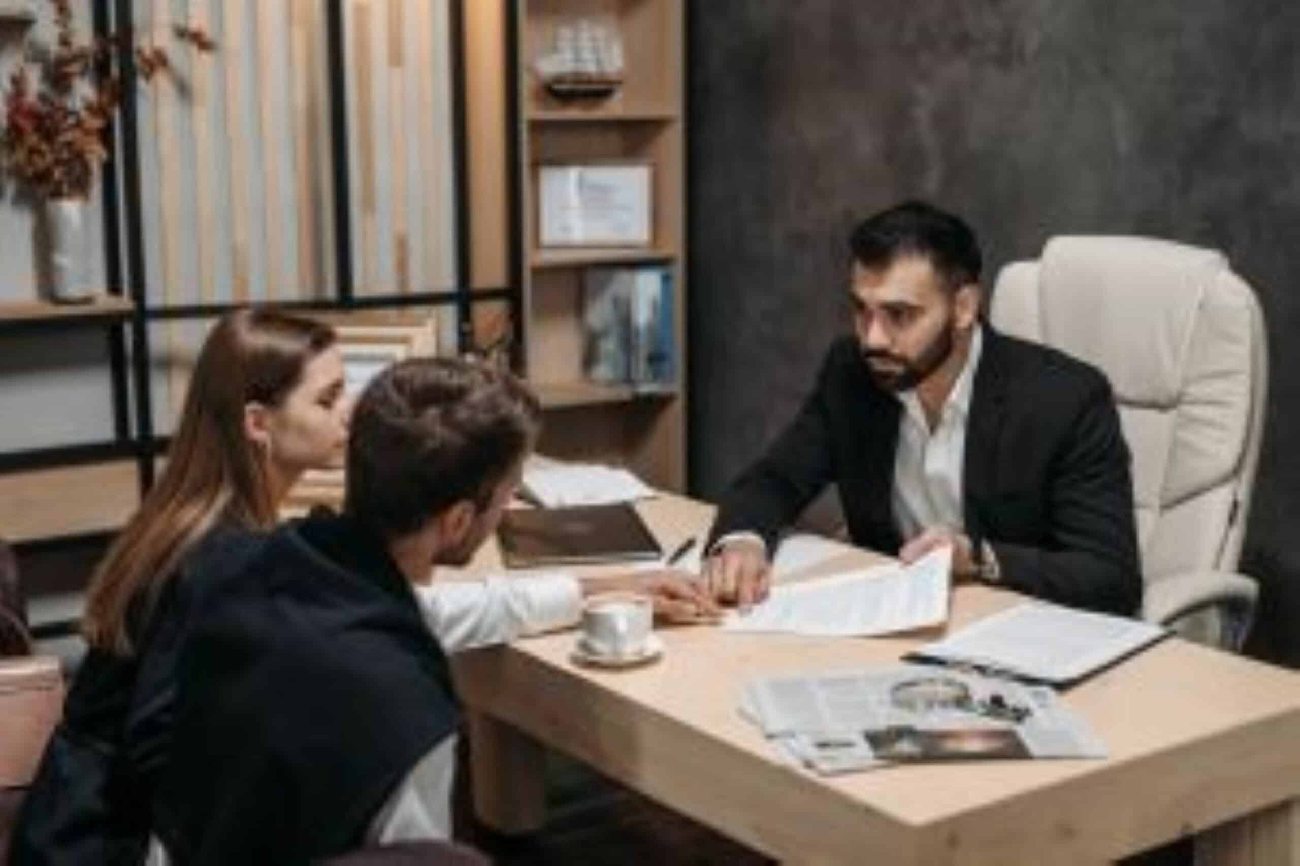 Lawyer in office with clients